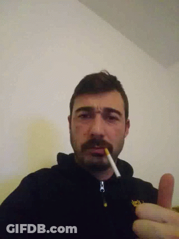 Bearded Man Smoking In Black Jacket With Yellow O GIF