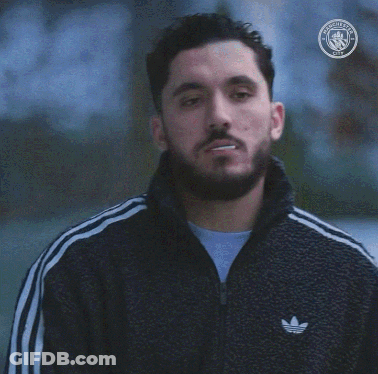 Bearded Man Smoking With Manchester City Logo GIF