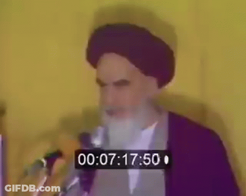 Bearded Man Speaking At Microphone With Timer GIF