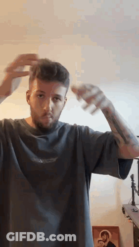 Bearded Man Spraying His Hair GIF