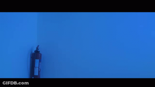 Bearded Man Standing In Blue Light GIF