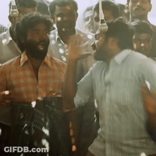 Bearded Man Standing In Crowd GIF