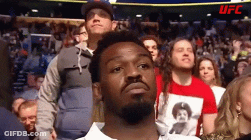 Bearded Man Standing In Crowd GIF