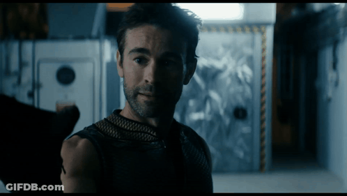 Bearded Man Standing In Dark Room GIF