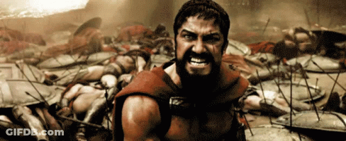 Bearded Man Standing In Front Of Battlefield GIF
