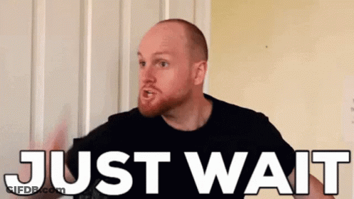 Bearded Man Standing In Front Of Door Saying Just Wait GIF