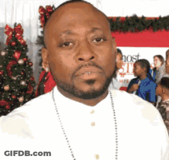 Bearded Man Standing In Front Of Host Sign GIF