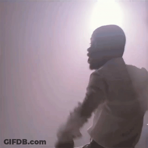 Bearded Man Standing In Front Of Purple GIF