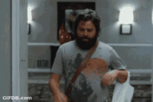 Bearded Man Standing In Room GIF