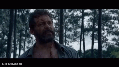 Bearded Man Standing In Woods GIF