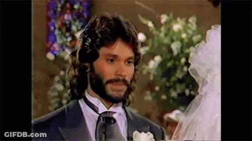 Bearded Man Standing Next To Bride In Wedding Dress GIF