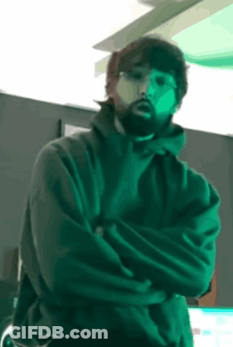 Bearded Man Standing With Crossed Arms GIF