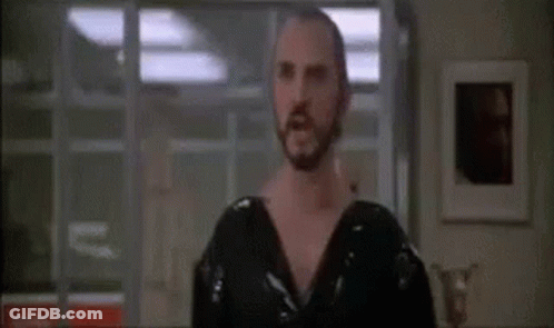 Bearded Man Standing With Word Kneel GIF