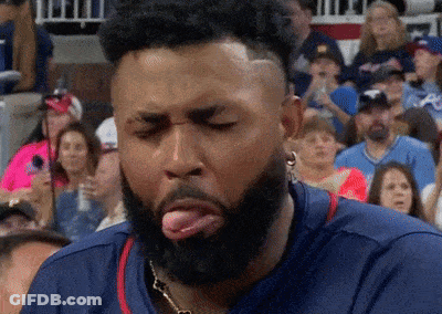 Bearded Man Sticking Tongue Out At Crowd GIF