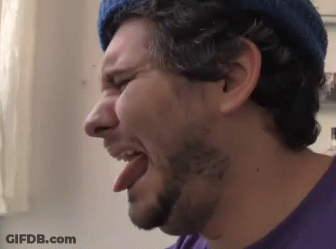 Bearded Man Sticking Tongue Out In Blue Hat GIF