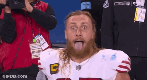 Bearded Man Sticking Tongue Out In NFL Jersey GIF