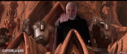 Bearded Man Surrounded By Robots GIF