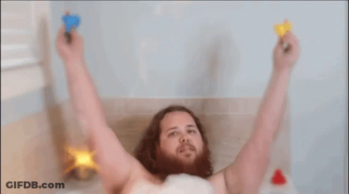 Bearded Man Taking Bath With Toys GIF