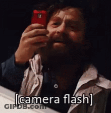 Bearded Man Taking Selfie In Mirror Camera Flash GIF