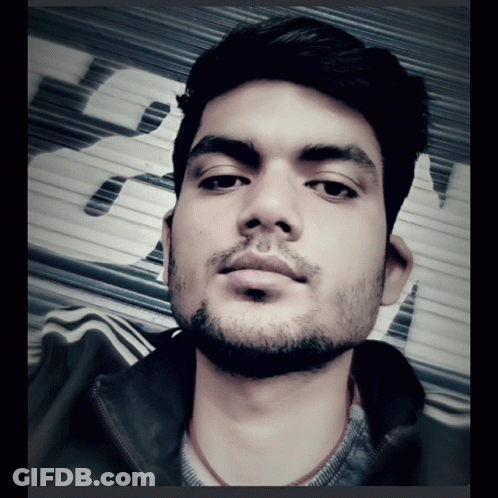 Bearded Man Taking Selfie With Sign Saying A GIF