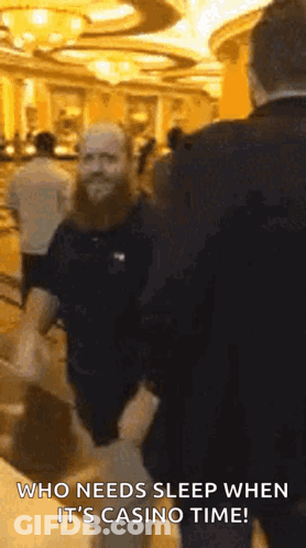 Bearded Man Talking In Casino GIF