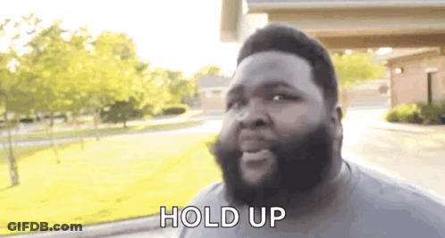 Bearded Man Talking In Front Of House GIF