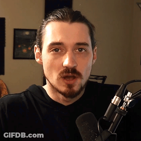 Bearded Man Talking Into Microphone GIF