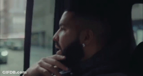 Bearded Man Talking On Phone In Back Seat GIF