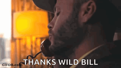 Bearded Man Talking On Phone Saying Thanks Wild Bill GIF