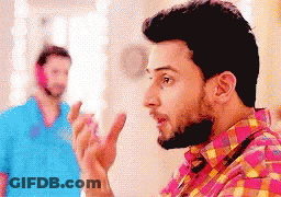 Bearded Man Talking To Man In Blue Shirt GIF