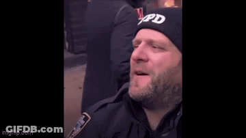 Bearded Man Touched By Police Officer In Black Hat GIF