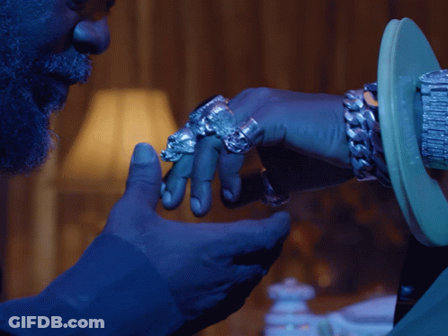 Bearded Man Touching Ringed Hand GIF