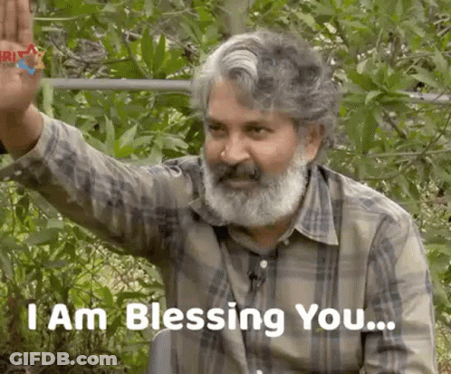 Bearded Man Waving Saying I Am Blessing You GIF