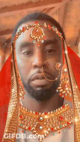 Bearded Man Wearing Gold Jewelry GIF