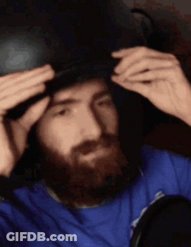 Bearded Man Wearing Hat Looking In Mirror GIF