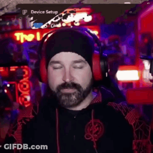 Bearded Man Wearing Headphones And Beanie Playing Video Game GIF