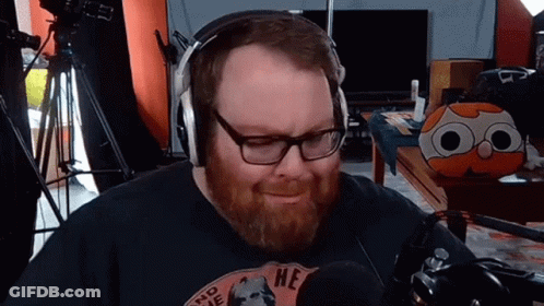 Bearded Man Wearing Headphones And 'He' Shirt GIF