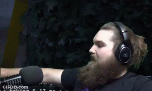 Bearded Man Wearing Headphones Pointing In Front Of Microphone GIF