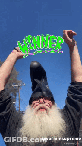 Bearded Man Wearing Helmet Holding Winner GIF