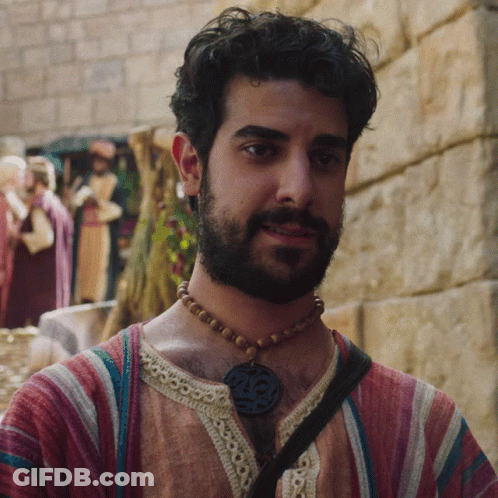 Bearded Man Wearing Necklace With Number 25 GIF