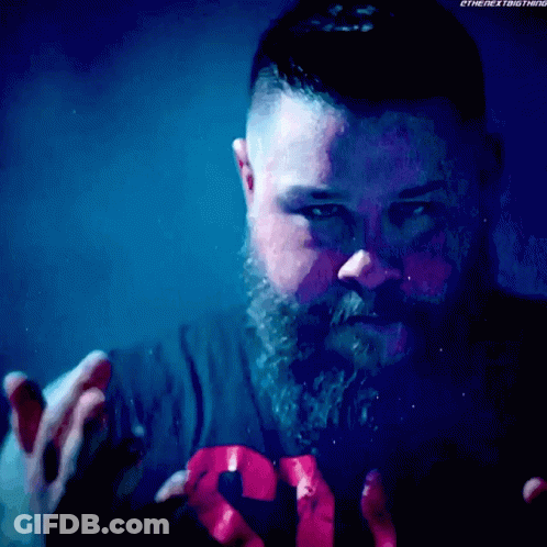 Bearded Man Wearing The Next Thing Shirt GIF