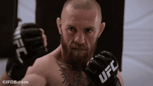 Bearded Man Wearing UFC Boxing Gloves GIF
