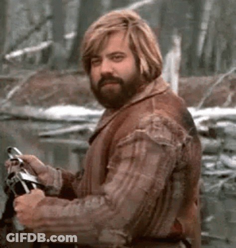 Bearded Man With Blonde Hair Holding Fishing Rod In Forest GIF