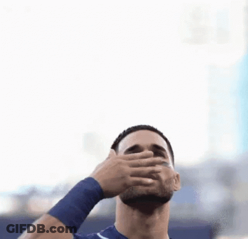 Bearded Man With Blue Wristband Reaching Up GIF