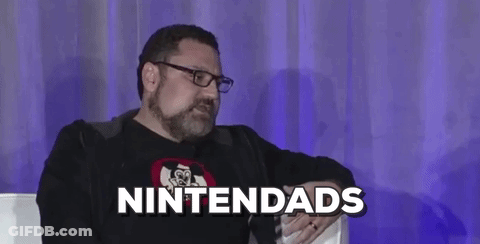 Bearded Man With Chain Smiling At Camera GIF