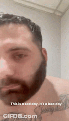 Bearded Man With Chest Tattoo Says This Is A Sad Day GIF