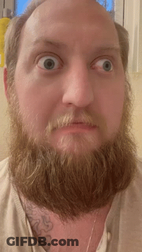 Bearded Man With Chest Tattoo Surprised GIF