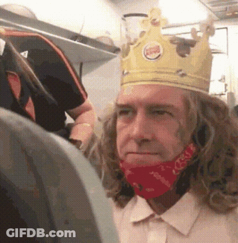 Bearded Man With Crown Looking Out GIF