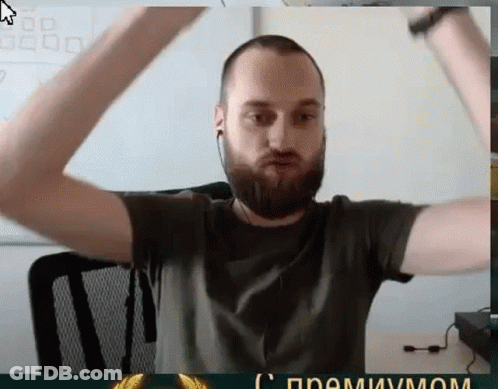 Bearded Man With Ear Buds Arms Raised GIF
