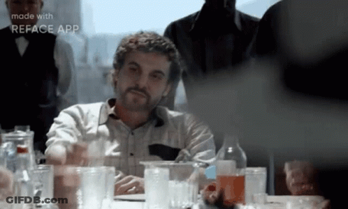 Bearded Man With Glasses And Alcohol Bottles GIF